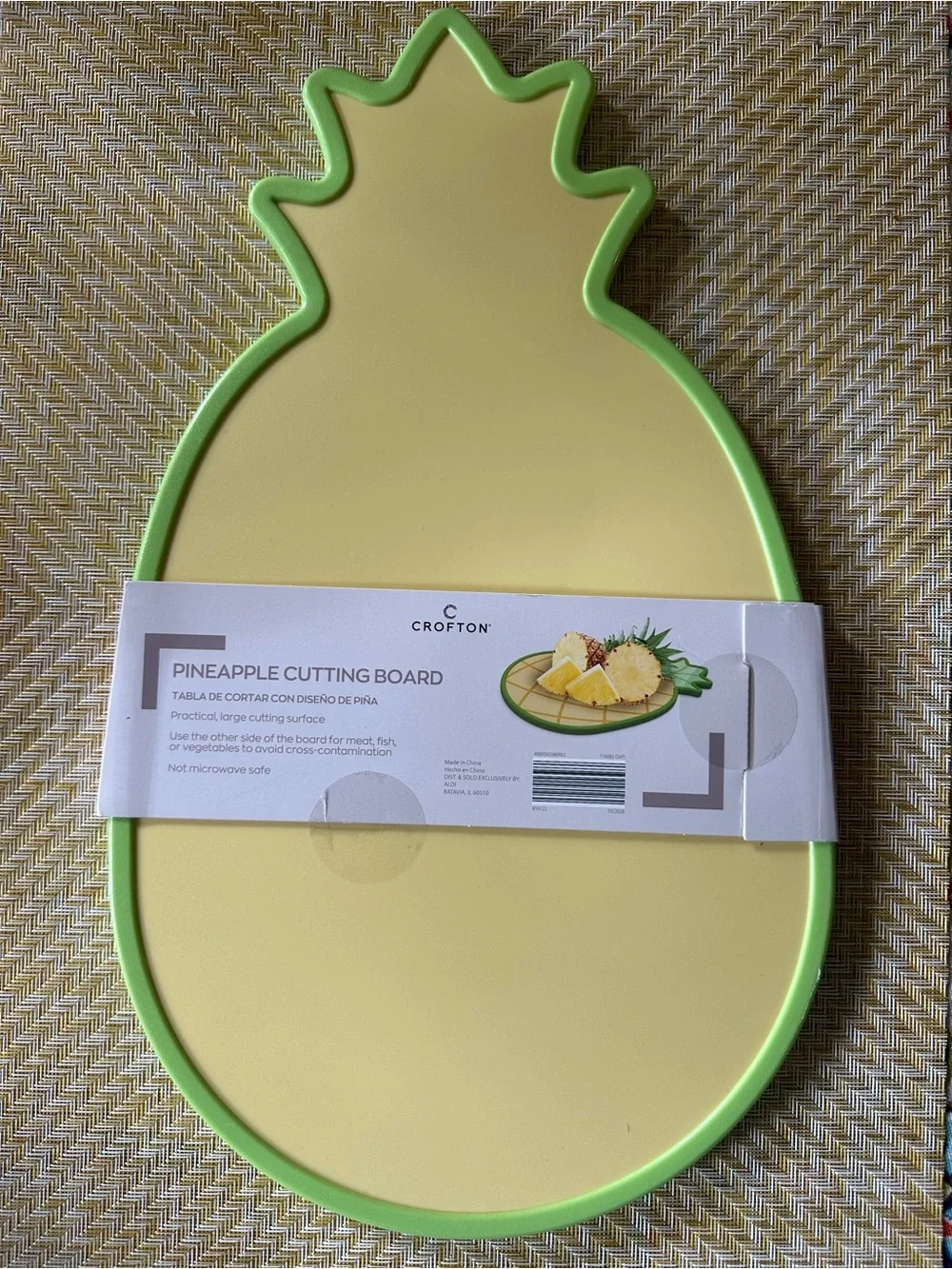 Croton Pineapple-Shaped Cutting Board in Yellow with Green Trim and Colander.